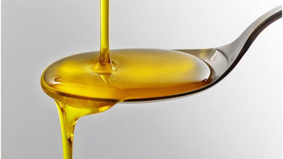 spoon of oil