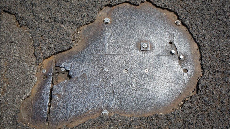 A detail of Hammersmith Bridge's damaged road surface