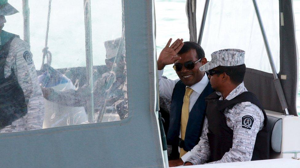 Former Maldives president Mohamed Nasheed (2nd R) waves as he is taken back to Maafushi Prison after attending Hight Court in Male City, Maldives September 9, 2015.