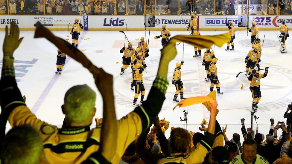 Fans cheer as the Nashville Predators celebrate after defeating the Pittsburgh Penguins with a score of 4 to 1 in Game Four of the 2017 NHL Stanley Cup Final at the Bridgestone Arena on June 5, 2017 in Nashville, Tennessee.