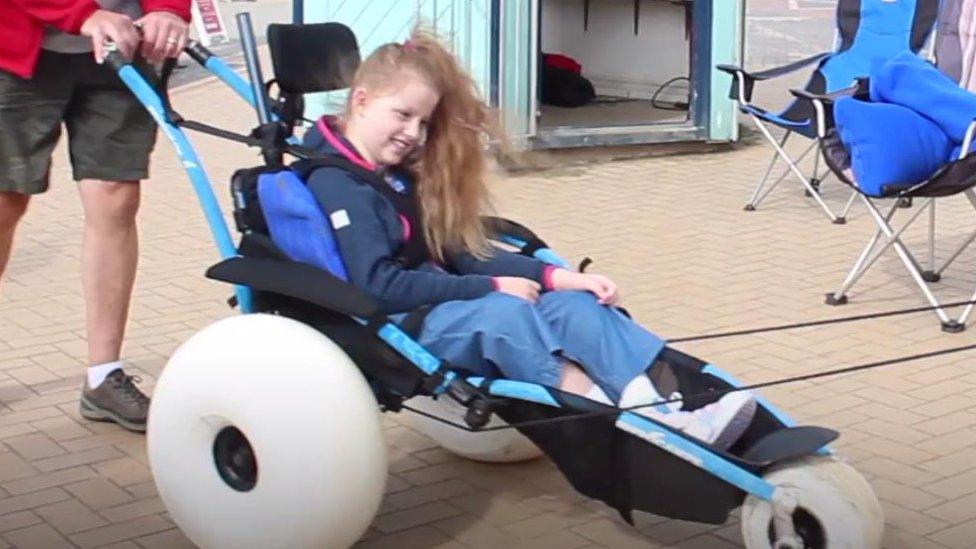 girl in beach wheelchair