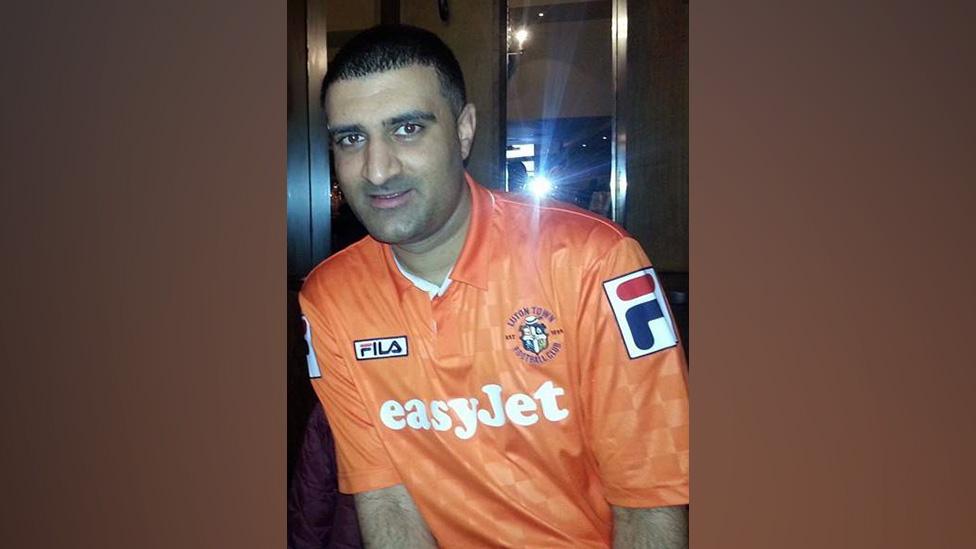 Tariq Khan wearing a Luton shirt with EasyJet on it