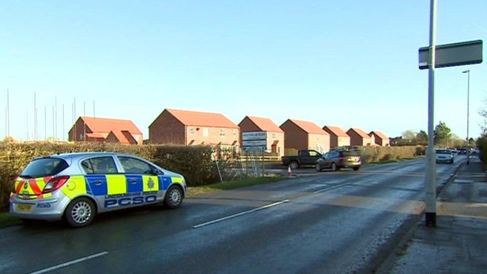 Police car at location where Mt Toner's body was found in Holton le Clay, Lincolnshire