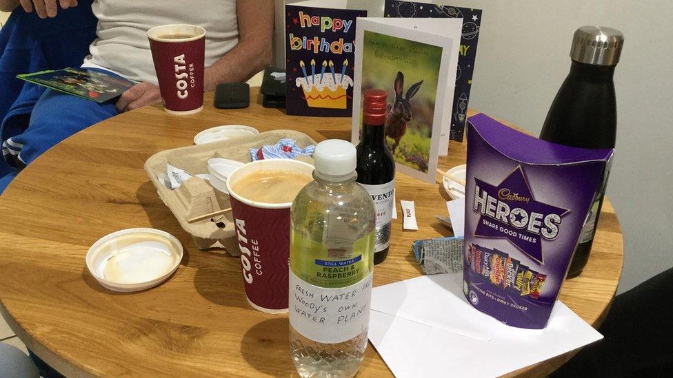 Birthday cards, Heroes, and Costa coffees on table