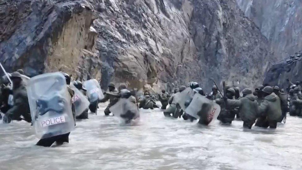 This video frame grab taken from footage recorded in mid-June 2020 and released by China Central Television (CCTV) on February 20, 2021 shows Indian soldiers crossing a river during an incident