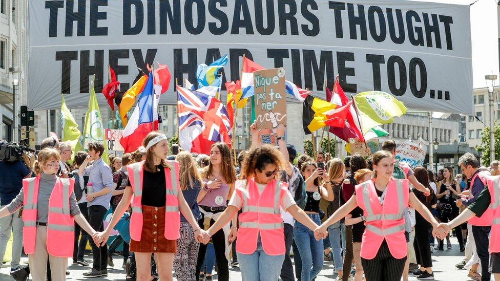 People take part in a demonstration in Brussels