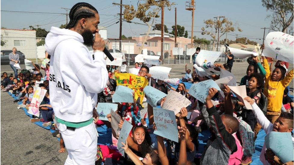 Hussle speaking to children in LA