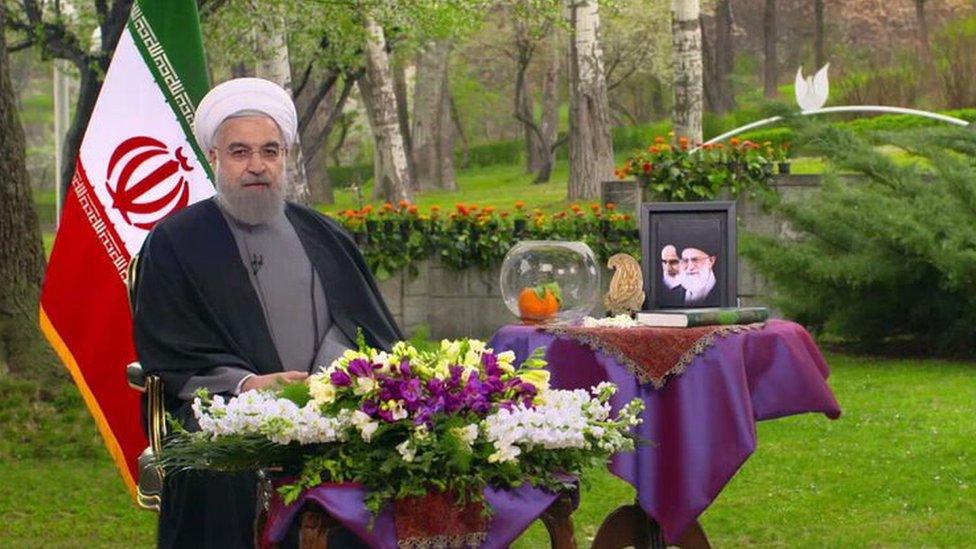 The photo of President Hassan Rouhani with his Haft Seen table