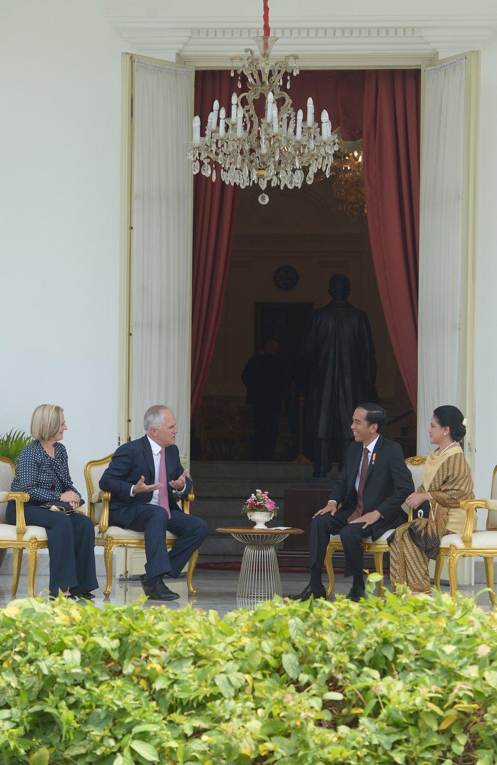 Indonesian President Joko Widodo (2nd R), accompanied by wife Iriana Widodo (R), meets with Australia's Prime Minister Malcolm Turnbull (2nd L) and his wife Lucy Turnbull (L) at the presidential palace in Jakarta on November 12, 2015. Turnbull made his first visit to Indonesia since taking power, seeking to repair a key relationship strained by repeated crises under his conservative predecessor