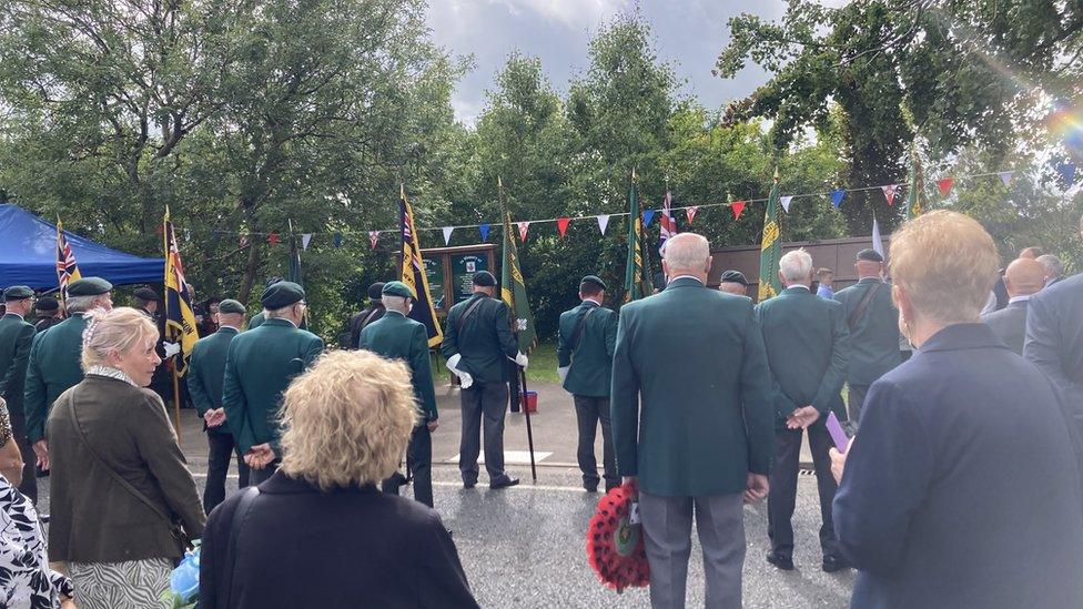 Survivors and families laying wreaths at service in Ballygawley