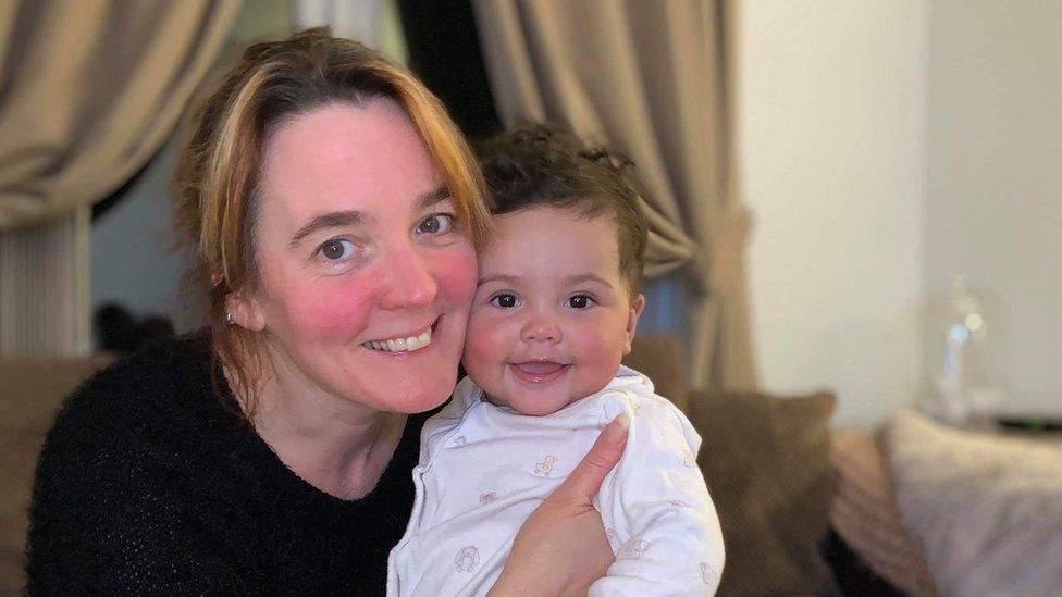 Cathryn McShane-Kouyaté and her grandchild