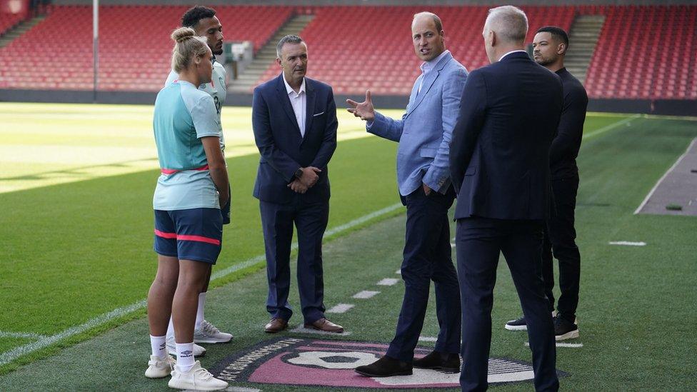 Prince William speaking to AFC Bournemouth players