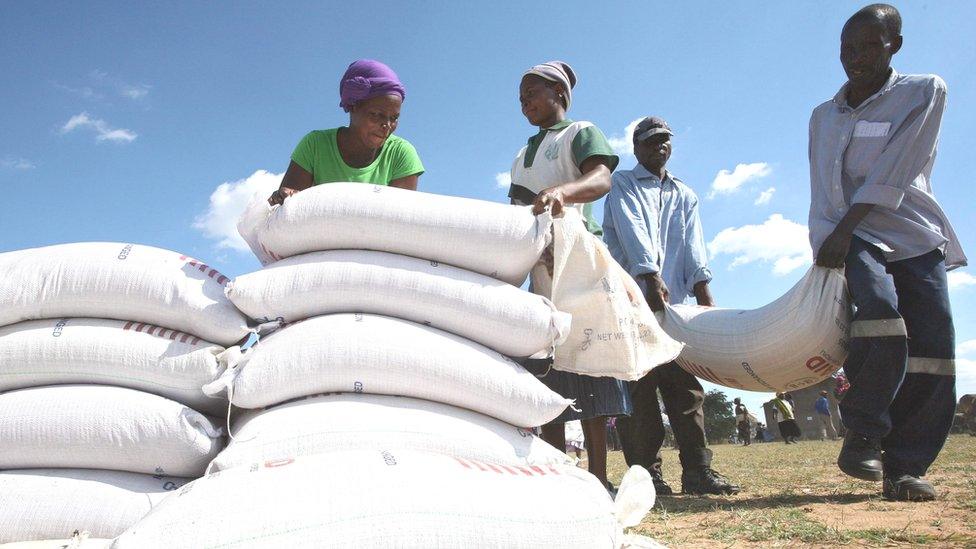 Zimbabweans receiving food aid