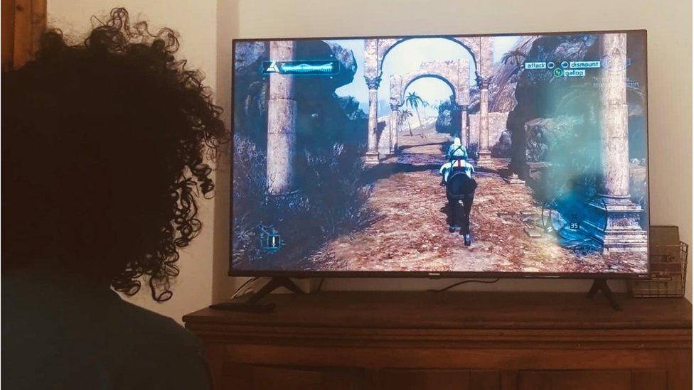 Eslam Gamal playing Assassin's Creed