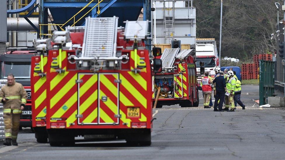 Fire trucks at silo