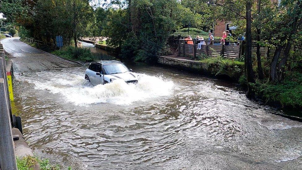 A Mini going through Rufford Ford