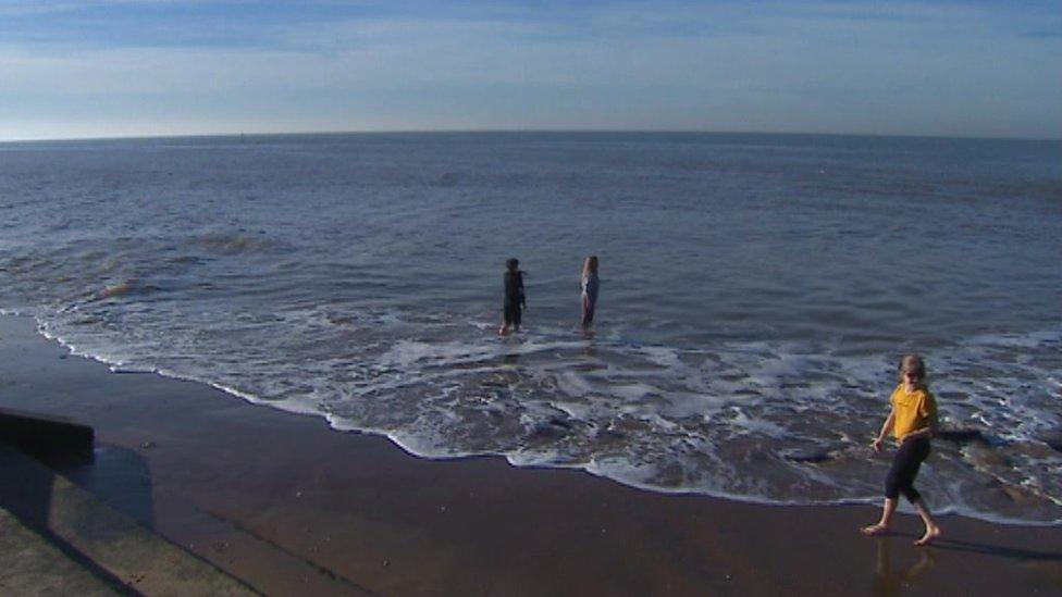 Children playing in the sea in Prestatyn