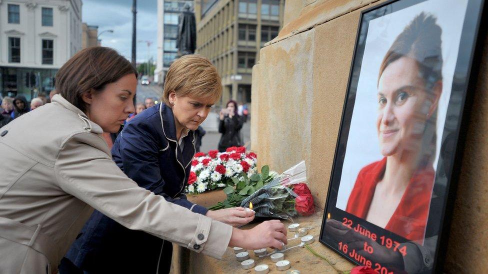 First Minister Nicola Sturgeon (centre) and Scottish Labour leader Kezia Dugdale attend a vigil in George Square