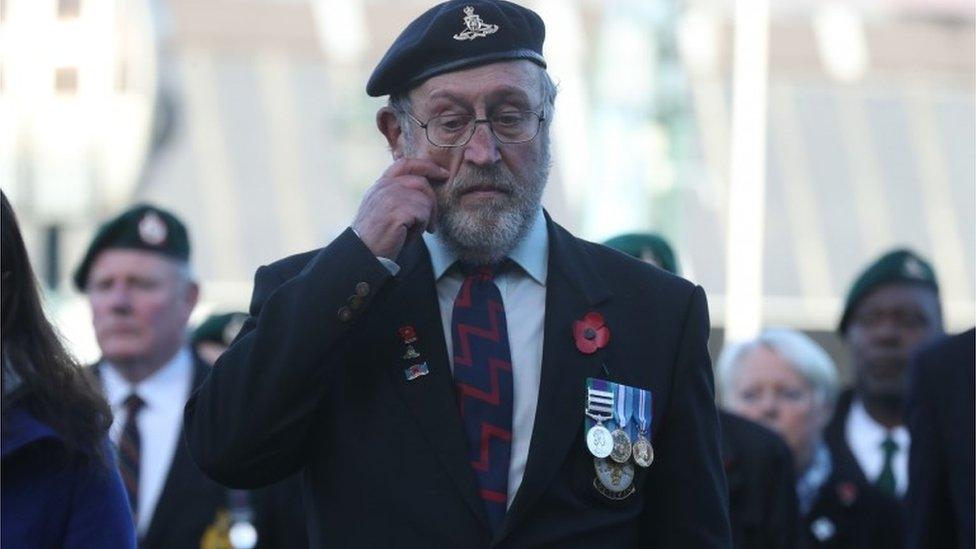 An emotional veteran at a service in Fort William