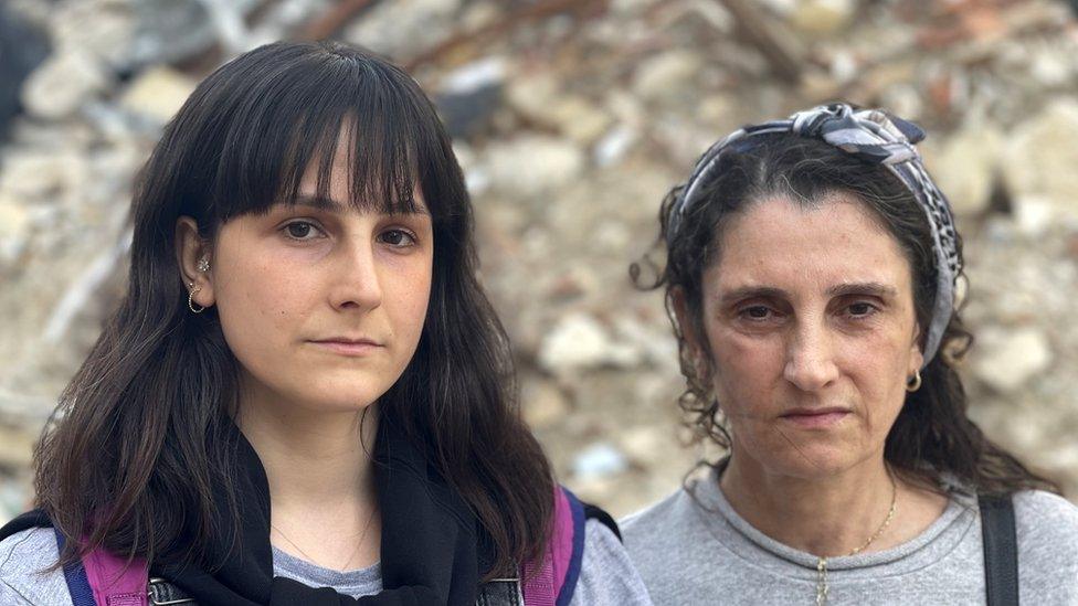 Gozde Burgac and her aunt Suheyla Kilic, pictured in front of rubble in Antakya