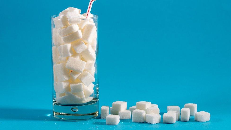 glass of sugar cubes