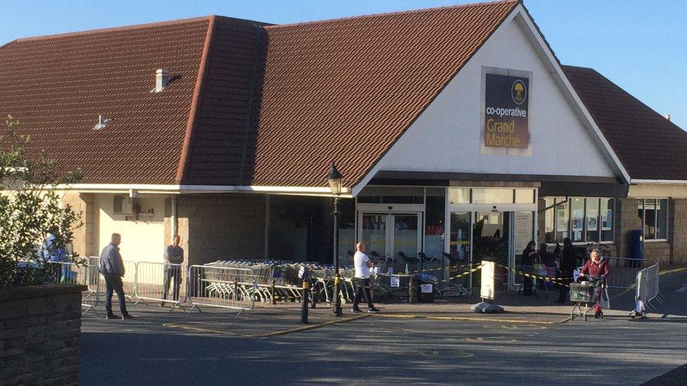 Shoppers social distancing outside a Guernsey supermarket