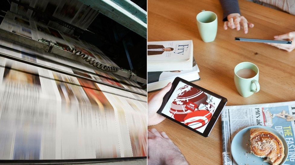 A printing press and a couple using tablet devices at the kitchen table