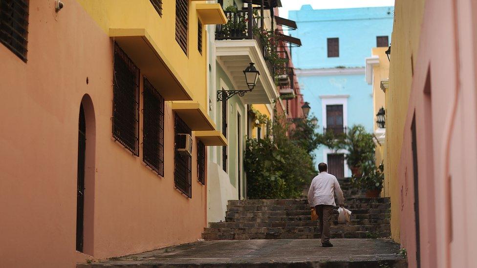 Man walking up a sidewalk in Puerto Rico