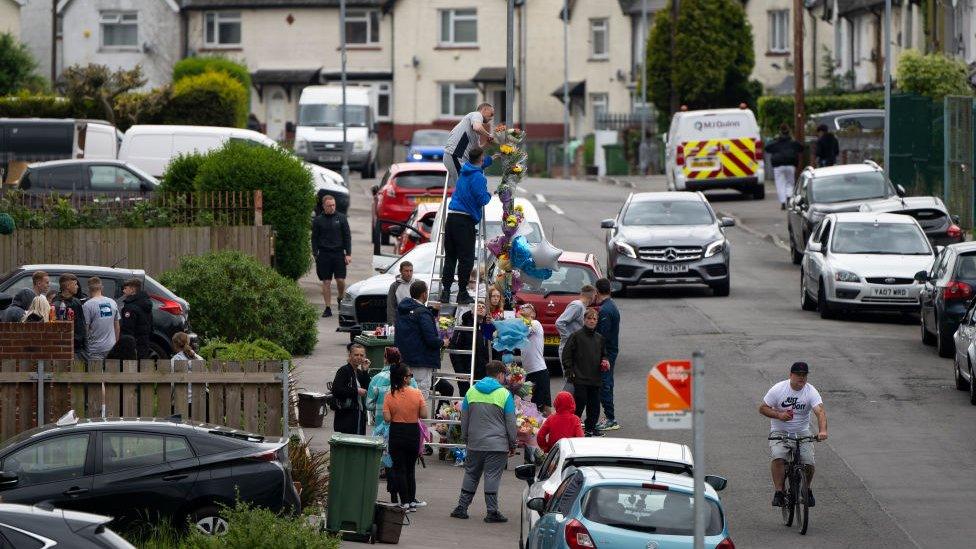 Floral tributes being left in Ely, Cardiff