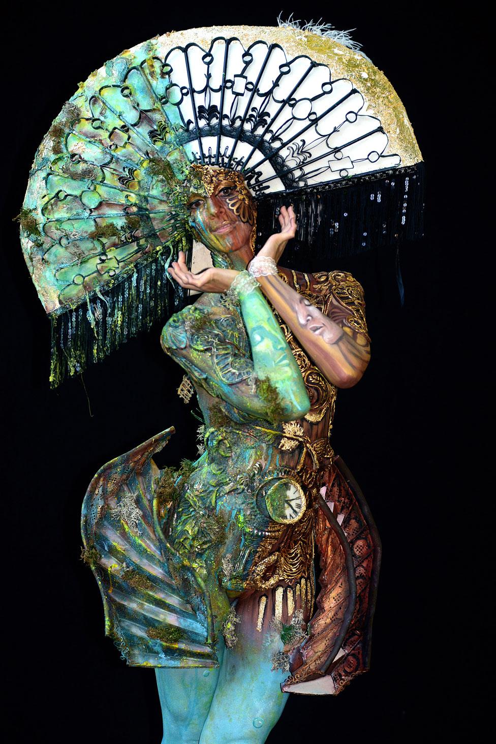 A model, painted by bodypainting artists Yvonne Zonnenberg-Hughes and Astric Hughes from South Africa, poses for a picture