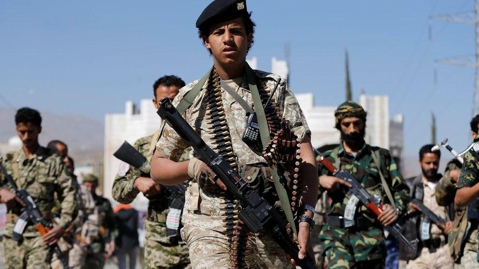 Houthi fighters parade in Sanaa on 19 December 2017