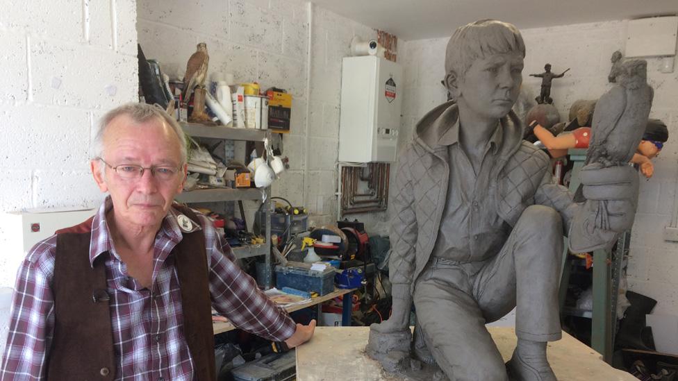 David Bradley with the statue