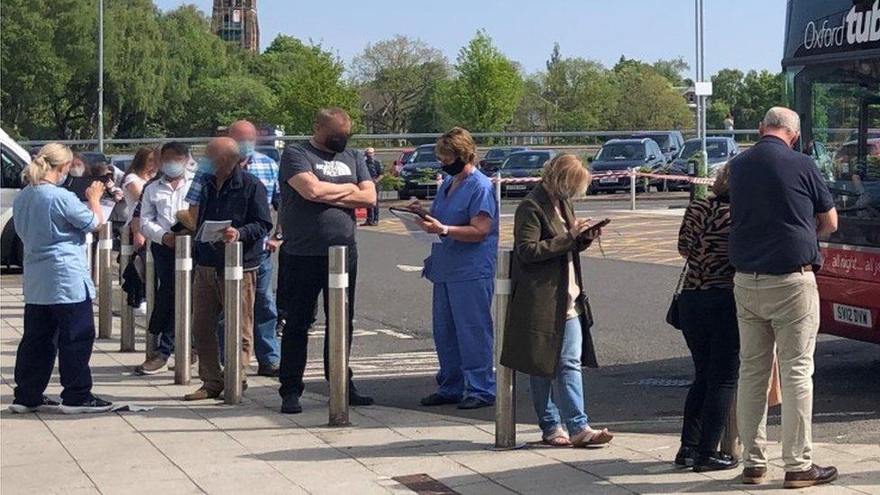 People in Glasgow queue to get vaccinated at the New Victoria Hospital drop-in centre