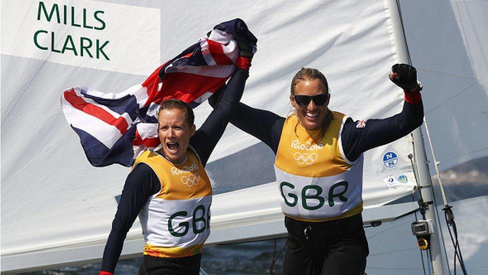 Team GB sailors Hannah Mills and Saskia Clark of Great Britain celebrate winning gold