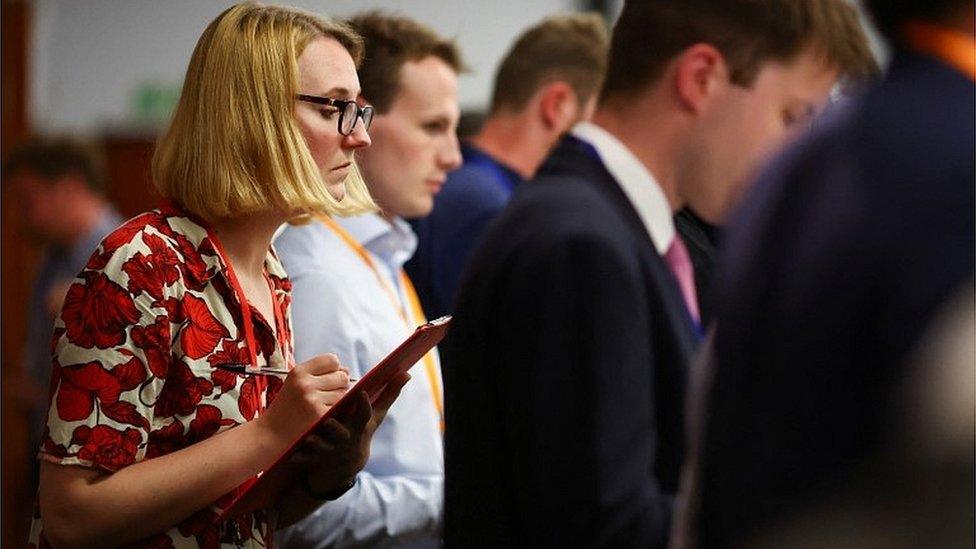 Official checking votes at a local election count