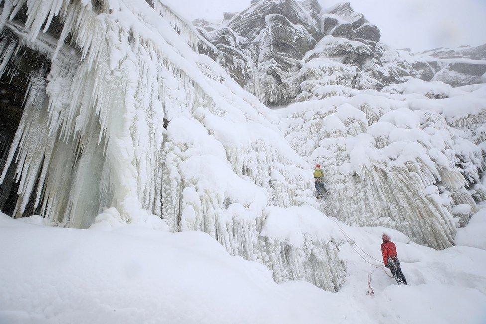 Ice climbers on the downfall at Kinder Downfall, High Peak in Derbyshire