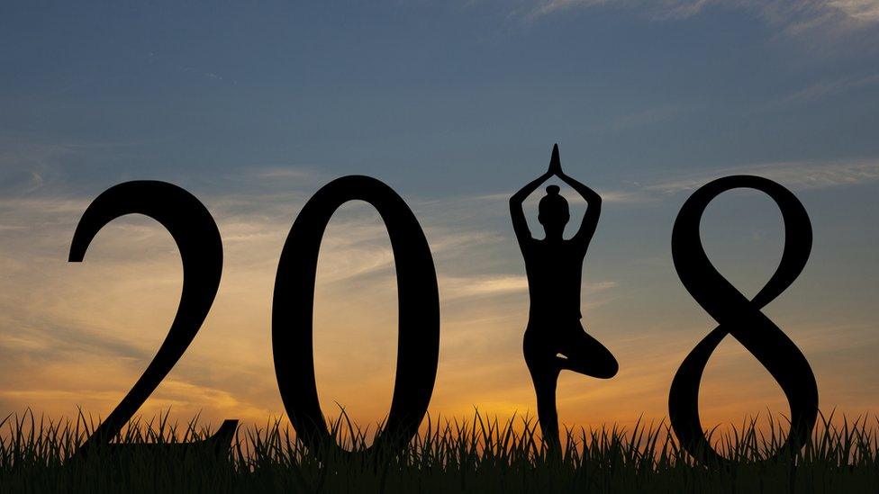 Woman doing yoga in 2018 pose