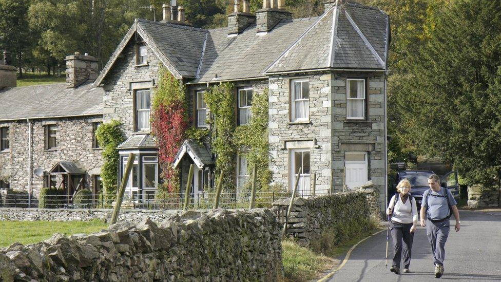 Two people walking in Grasmere