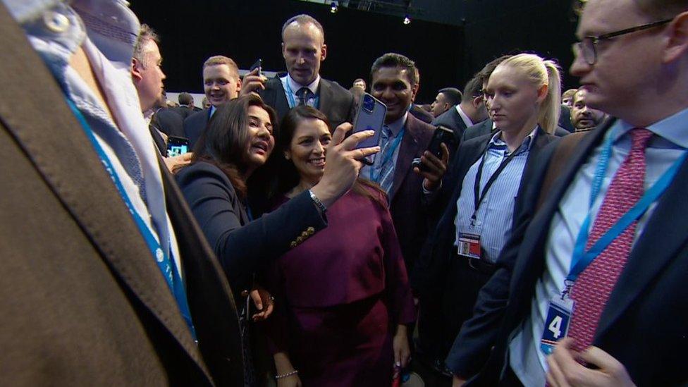 Priti Patel and audience members asking for selfies