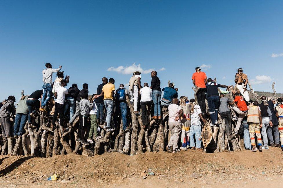 People trying to catch a glimpse of the proceedings