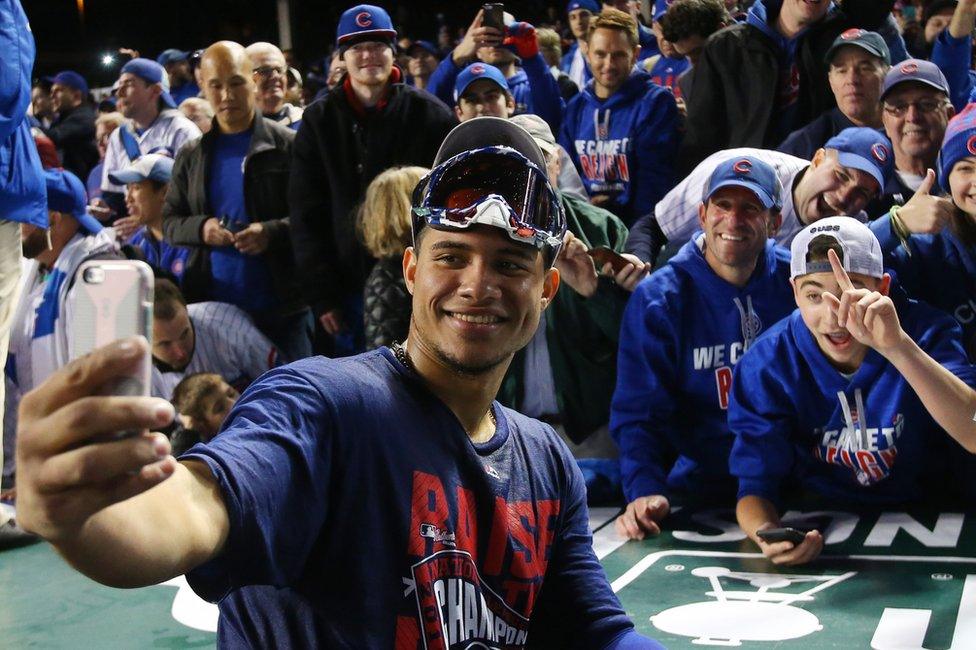 The Chicago Cubs celebrate in Chicago, 22 October