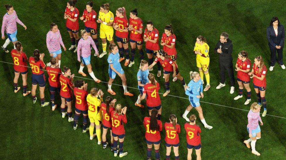 Spanish players applaud the England team after the World Cup final.