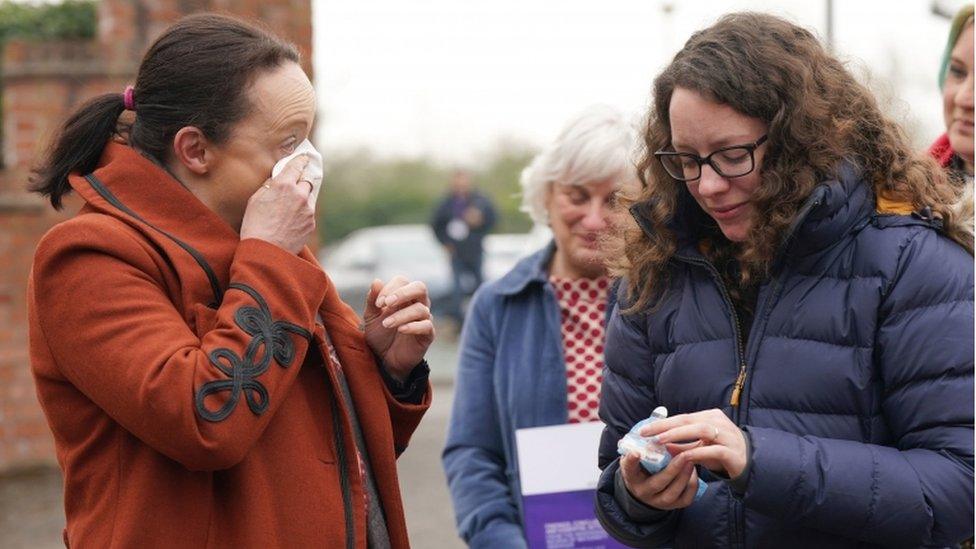 Rhiannon Davies (left) and Kayleigh Griffiths (right) react