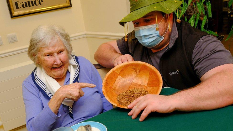 Doreen Barber, trying out eating grubs