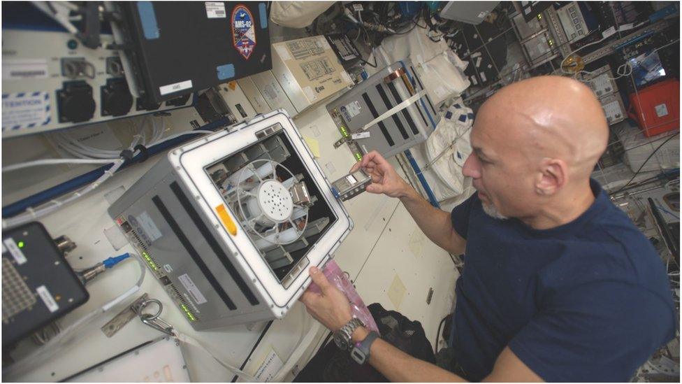 The Italian astronaut Luca Parmitano runs the BioRock experiment on the ISS