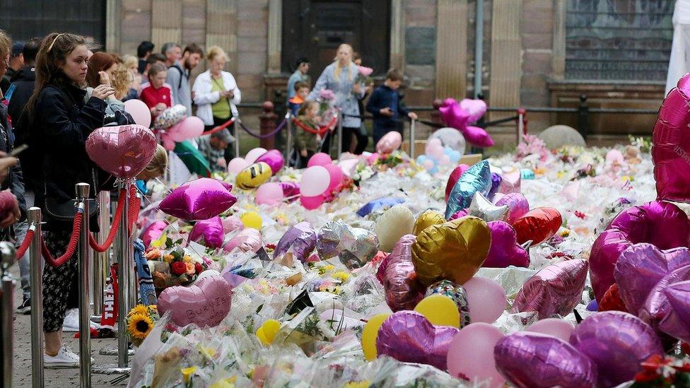 Balloons and flowers at a makeshift memorial at St Ann"s Square