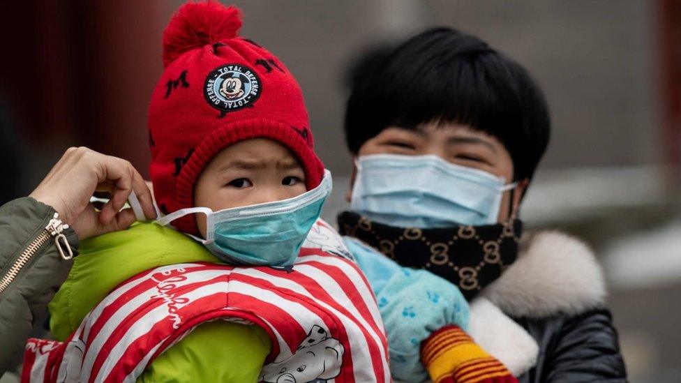 Child with face mask