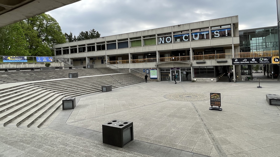 View of UEA campus with NO CUTS spelled out in large letter across windows