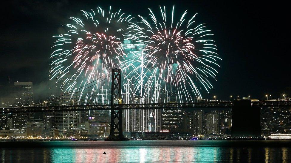 Fireworks light up the sky over the San Francisco-Oakland Bay Bridge in California on 1 January, 2016