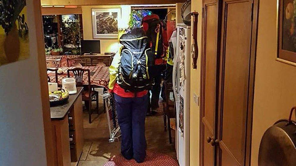 Mountain rescuers in house